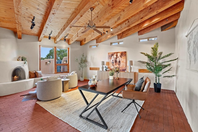 home office featuring a fireplace, brick floor, wood ceiling, and beamed ceiling