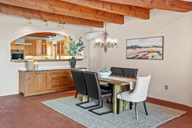 dining space featuring a wall unit AC, beamed ceiling, brick floor, arched walkways, and a notable chandelier