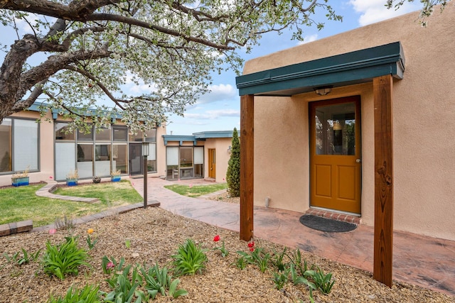 exterior space with stucco siding