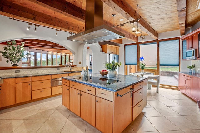 kitchen featuring island exhaust hood, track lighting, light tile patterned flooring, a kitchen island, and black electric stovetop