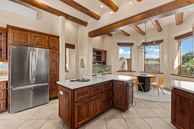kitchen featuring backsplash, freestanding refrigerator, a wall mounted air conditioner, and light tile patterned floors