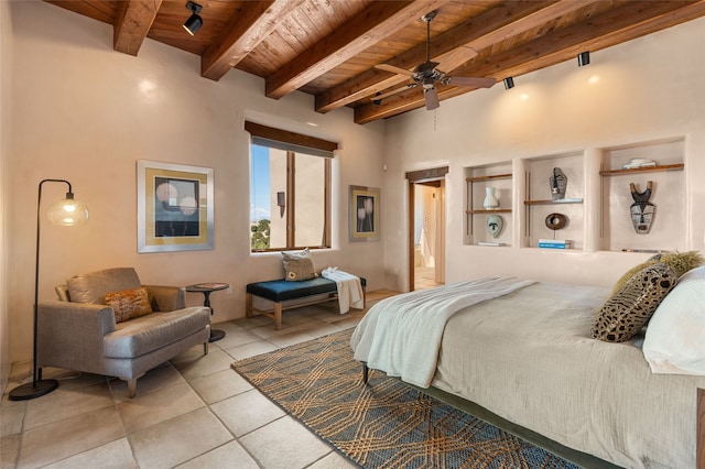 bedroom featuring beamed ceiling, wood ceiling, and light tile patterned flooring