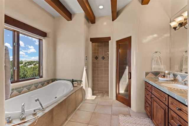 bathroom featuring tile patterned floors, beam ceiling, a tile shower, a garden tub, and vanity
