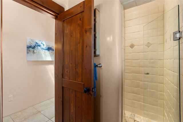 full bath with tile patterned floors and a shower stall