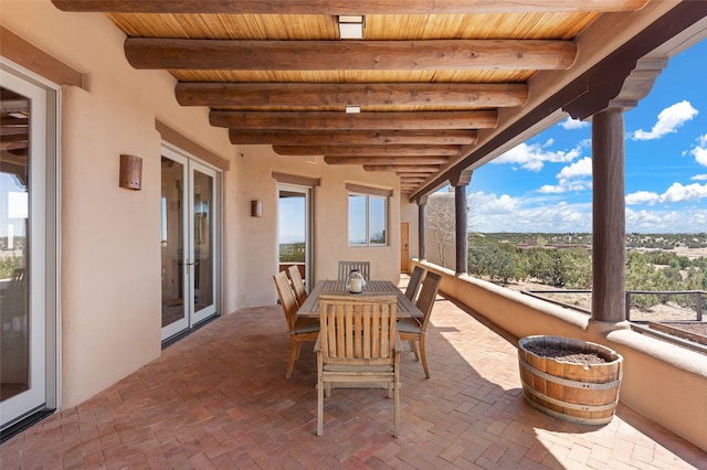 view of patio / terrace with french doors and a balcony