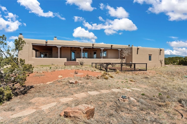 view of front of property with stucco siding and covered porch
