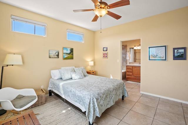 bedroom with ensuite bathroom, baseboards, a ceiling fan, and light tile patterned flooring