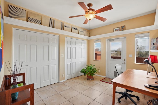 office area featuring ceiling fan, baseboards, and light tile patterned floors