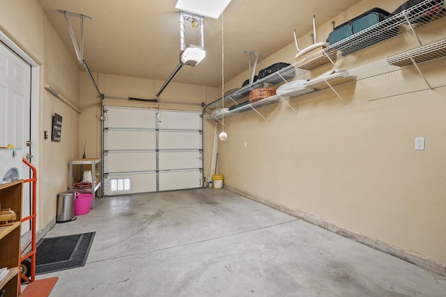 garage featuring baseboards and a garage door opener
