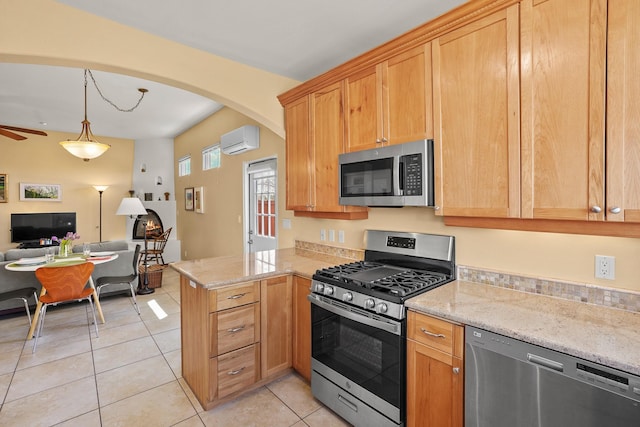 kitchen with a wall mounted air conditioner, light tile patterned flooring, open floor plan, arched walkways, and appliances with stainless steel finishes
