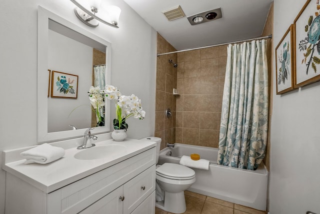 bathroom with tile patterned flooring, visible vents, toilet, vanity, and shower / tub combo