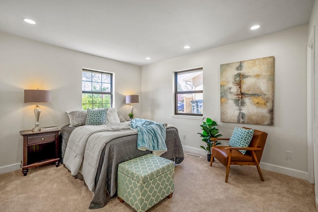 bedroom with recessed lighting, visible vents, baseboards, and light carpet