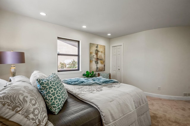 bedroom featuring recessed lighting, visible vents, carpet floors, a closet, and baseboards
