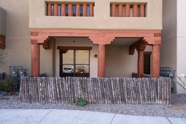 1405 Vegas Verdes Unit 136, Santa Fe, NM 87507 - doorway to property with stucco siding