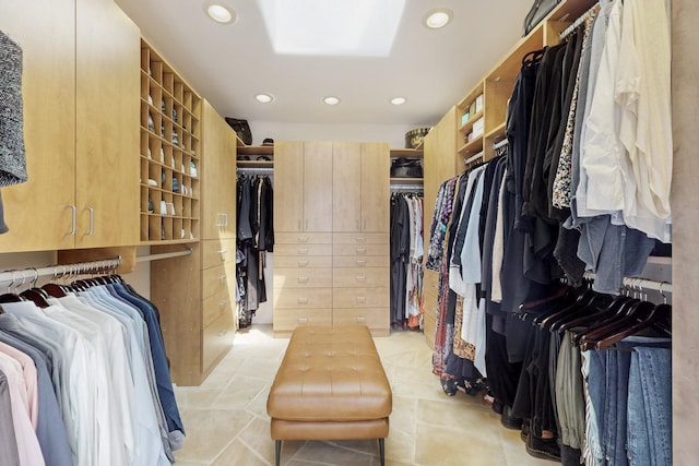 spacious closet featuring light tile patterned floors