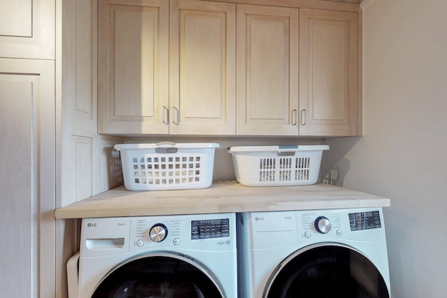 laundry room with cabinet space and independent washer and dryer