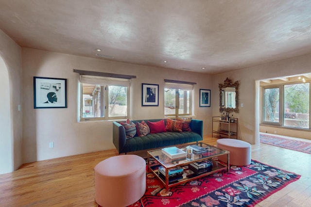 living area featuring wood finished floors and recessed lighting