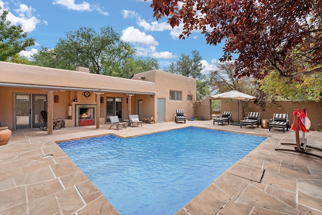 view of swimming pool featuring fence, a patio area, and a fenced in pool