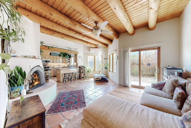 living room featuring beamed ceiling, wood ceiling, ceiling fan, and light tile patterned floors