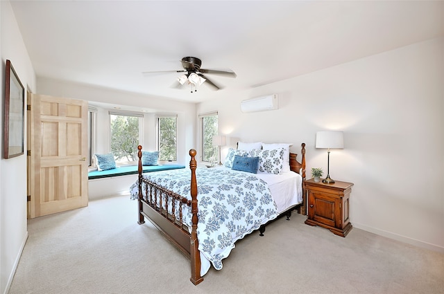 bedroom featuring a wall mounted AC, carpet, baseboards, and ceiling fan
