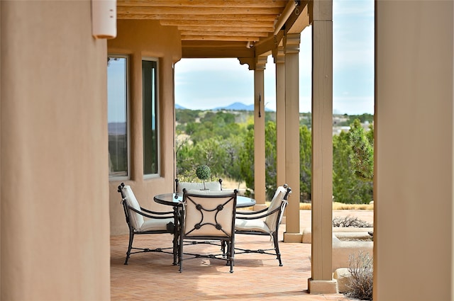 exterior space featuring wood finished floors and a mountain view