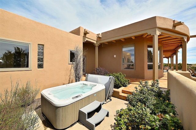 view of patio featuring a hot tub