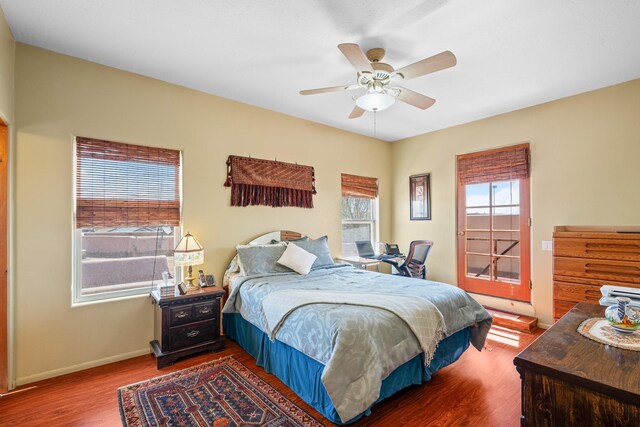 bedroom featuring baseboards, a ceiling fan, and wood finished floors