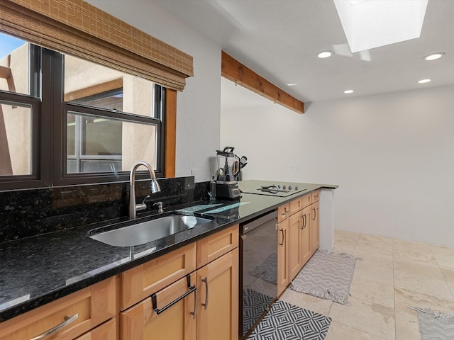 kitchen with a wealth of natural light, a sink, recessed lighting, and black appliances