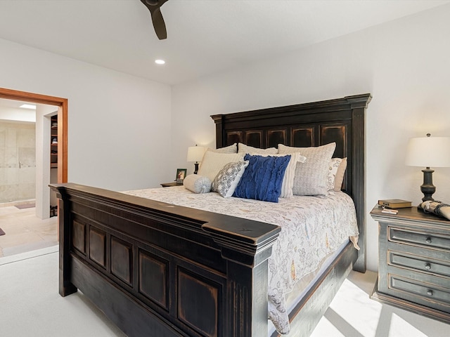 bedroom featuring connected bathroom, a ceiling fan, and recessed lighting
