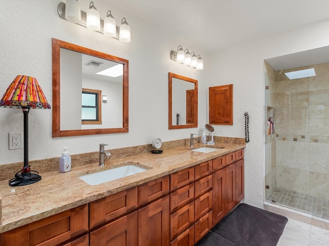 full bathroom featuring visible vents, a sink, double vanity, and a stall shower