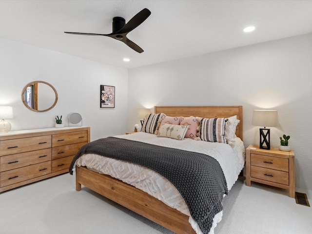 bedroom with light carpet, recessed lighting, and ceiling fan