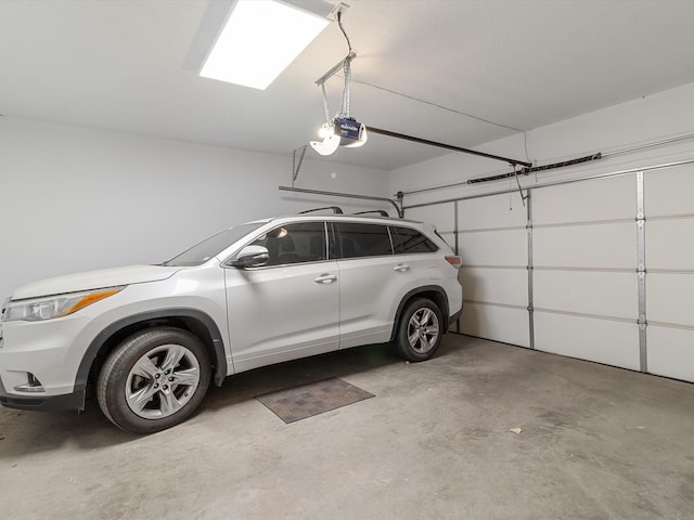 garage featuring a garage door opener
