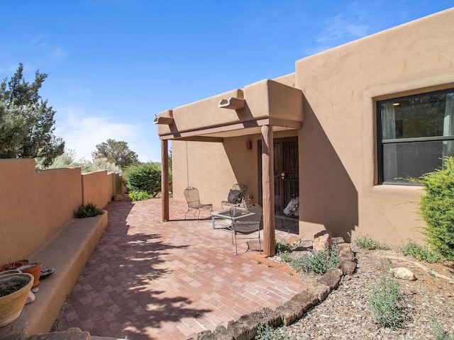 view of patio featuring fence