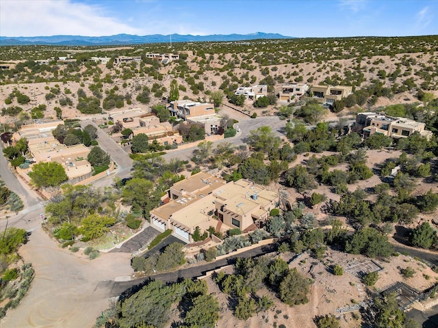bird's eye view featuring a desert view and a mountain view