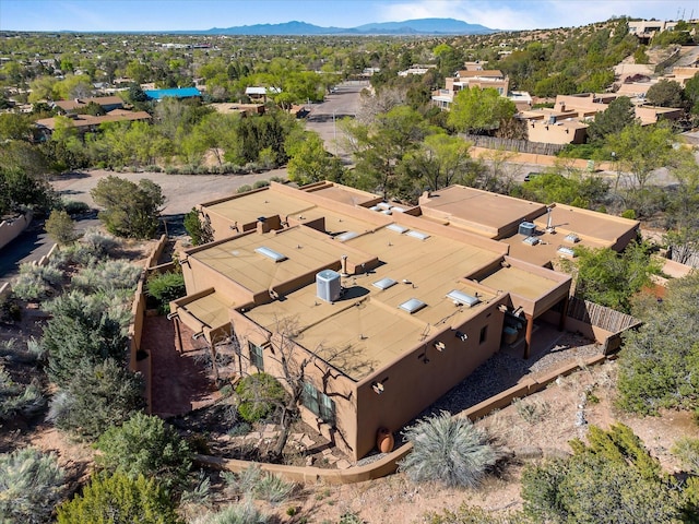 drone / aerial view featuring a residential view and a mountain view