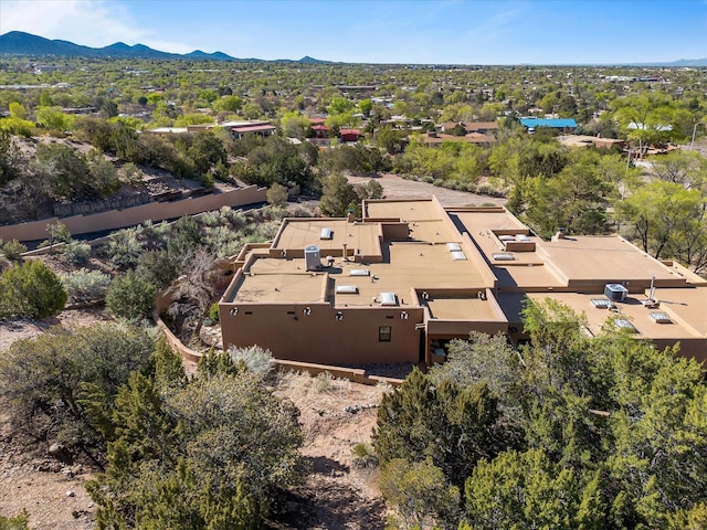 birds eye view of property featuring a mountain view