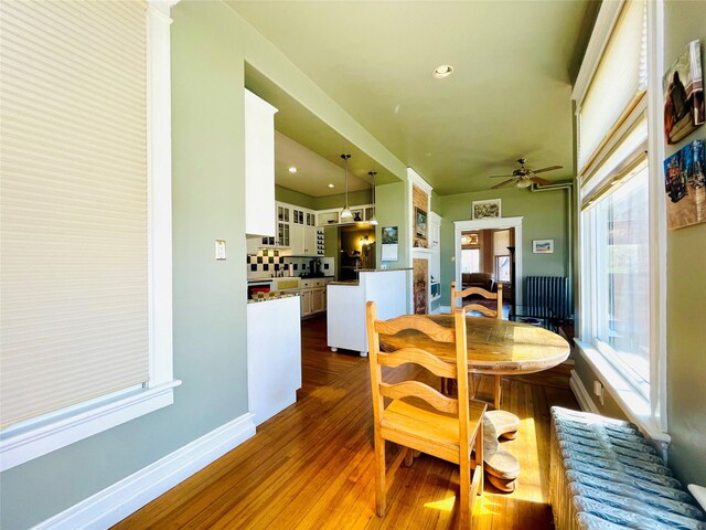 1607 8th St, Las Vegas, NM 87701 - dining space featuring baseboards, recessed lighting, dark wood-type flooring, and ceiling fan