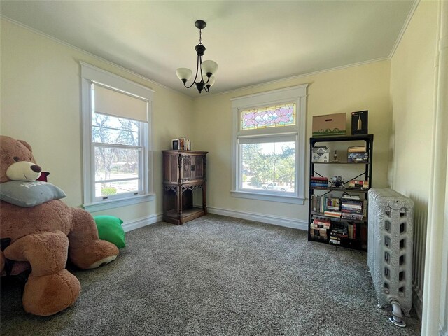1607 8th St, Las Vegas, NM 87701 - interior space with an inviting chandelier, baseboards, carpet, and crown molding