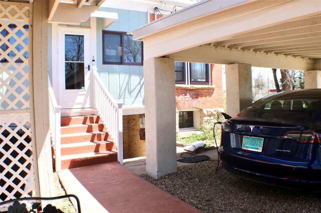 1607 8th St, Las Vegas, NM 87701 - view of exterior entry featuring a carport