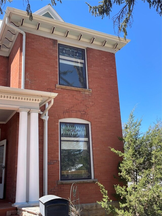 1607 8th St, Las Vegas, NM 87701 - view of side of home featuring brick siding