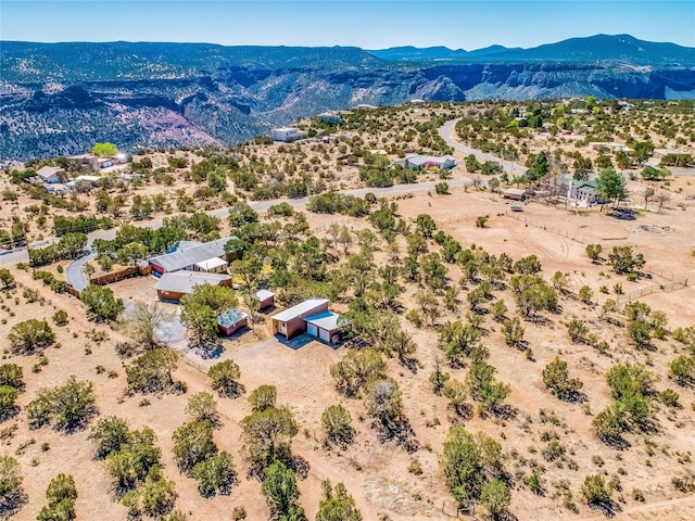 bird's eye view with view of desert and a mountain view