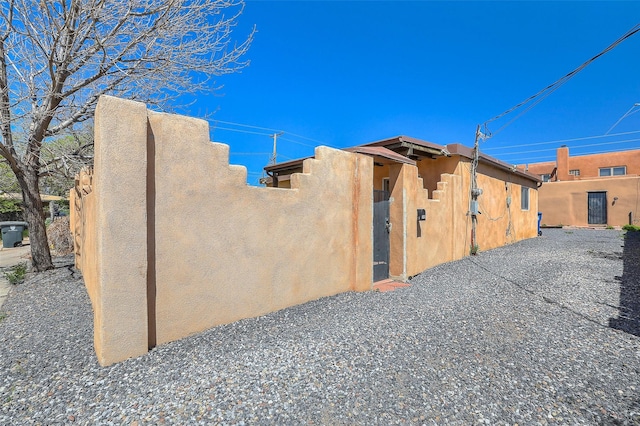 view of side of home featuring stucco siding