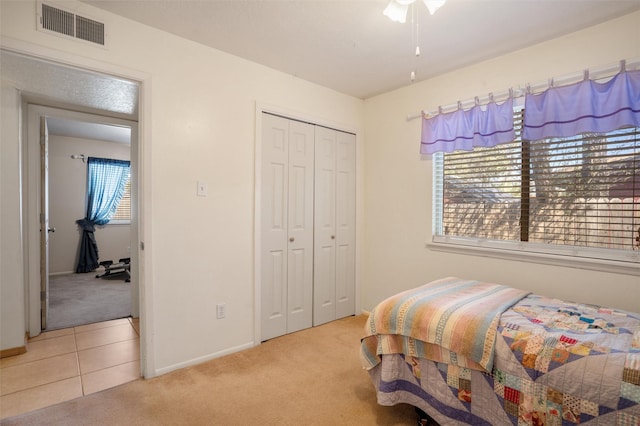 2416 Avenida De Las Campanas, Santa Fe, NM 87507 - bedroom with light colored carpet, baseboards, and a closet