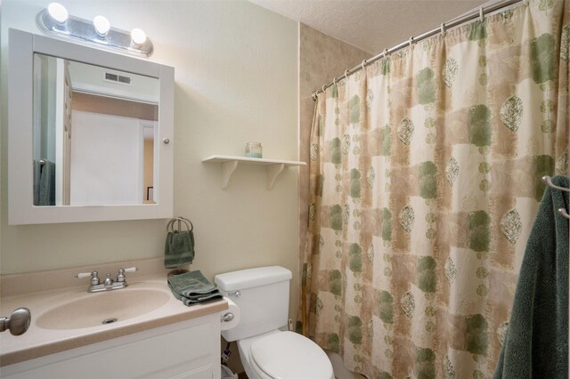 2416 Avenida De Las Campanas, Santa Fe, NM 87507 - bathroom with vanity, toilet, a textured ceiling, and a shower with curtain