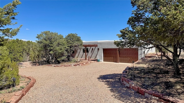 view of yard featuring driveway and an attached garage