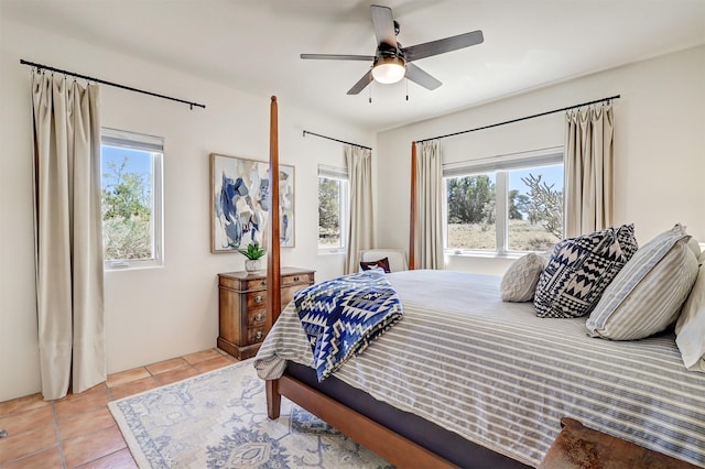 bedroom with tile patterned floors and a ceiling fan