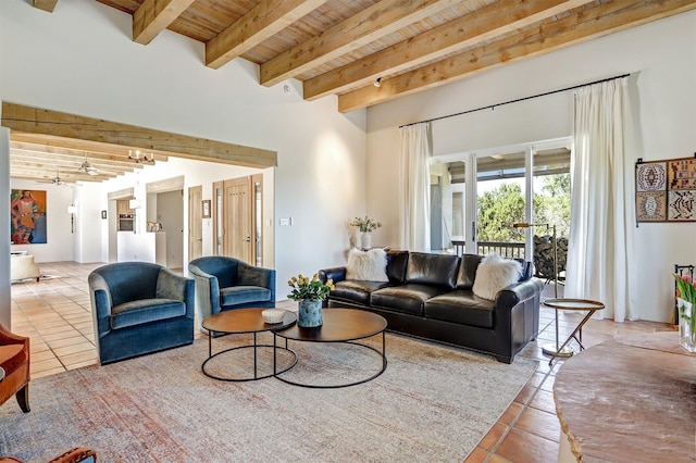 living room featuring beam ceiling, wooden ceiling, tile patterned floors, and ceiling fan