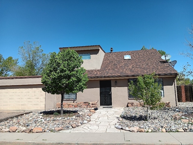 1094 Sunshine, Santa Fe, NM 87507 - view of front of property featuring stucco siding, an attached garage, and roof with shingles