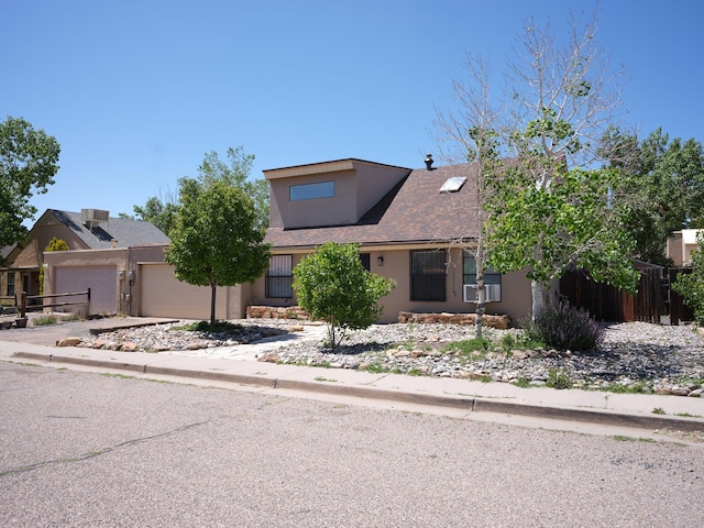 1094 Sunshine, Santa Fe, NM 87507 - interior space with a breakfast bar, dark countertops, tile patterned floors, a towering ceiling, and stainless steel fridge with ice dispenser
