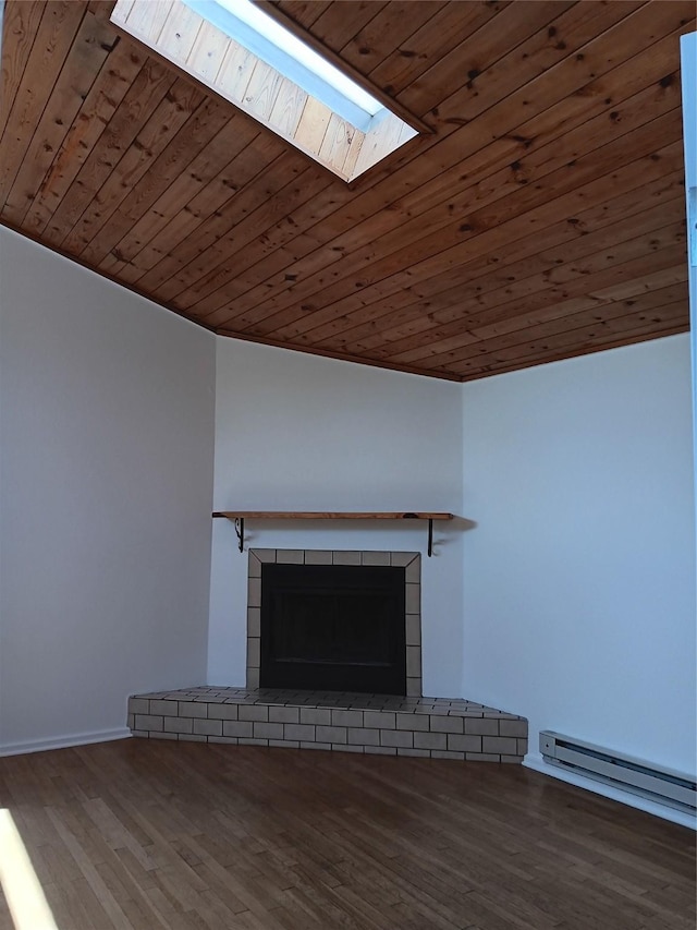 room details with a baseboard radiator, a fireplace with raised hearth, wooden ceiling, wood finished floors, and a skylight